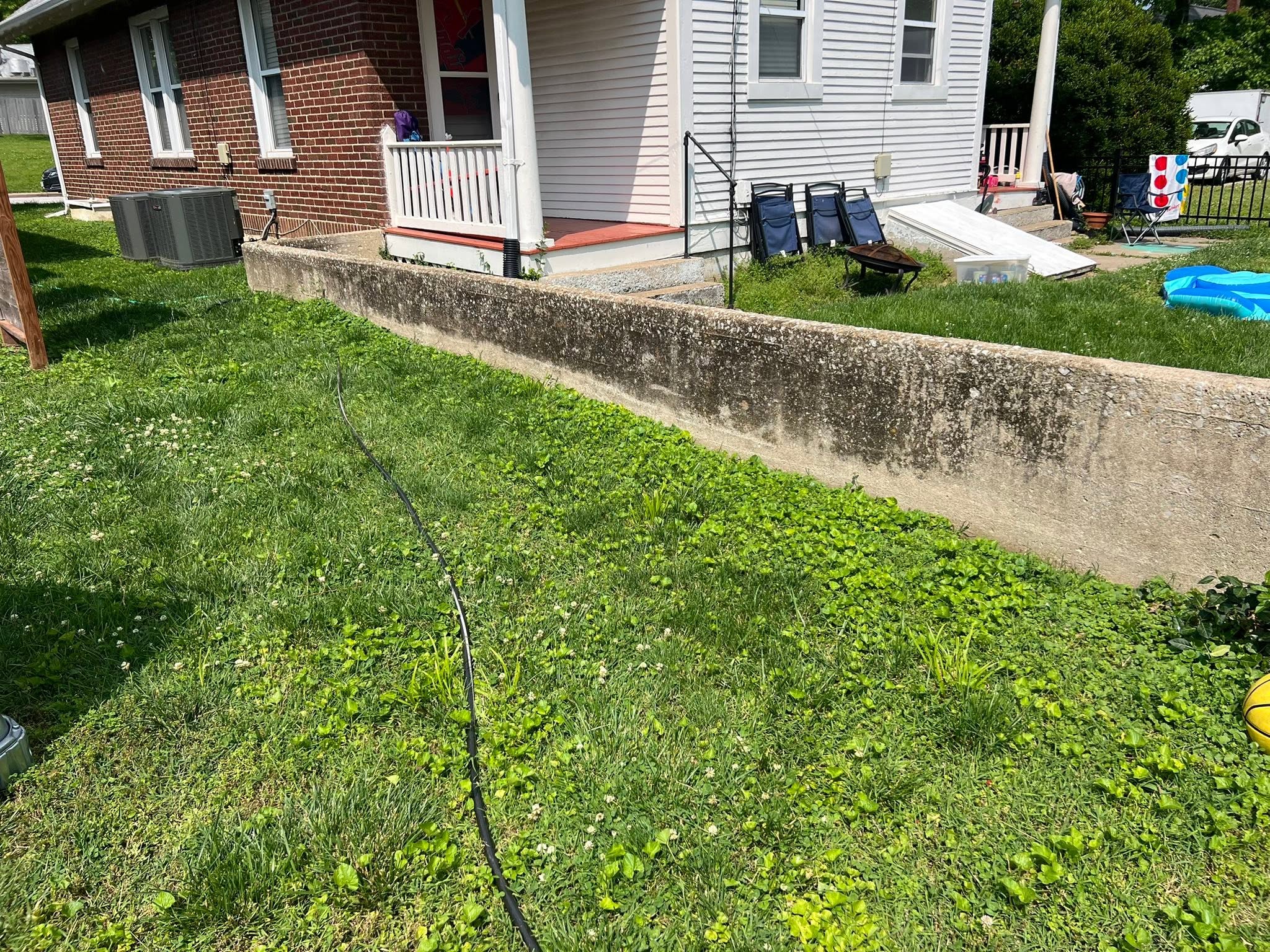 Dirty mildewed concrete retaining wall